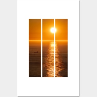 Wonderful landscapes in Norway. Nord-Norge. Beautiful scenery of a midnight sun sunset at Nordkapp (Cape North). Boat and globe on a cliff. Rippled sea and clear orange sky. (vertical) Posters and Art